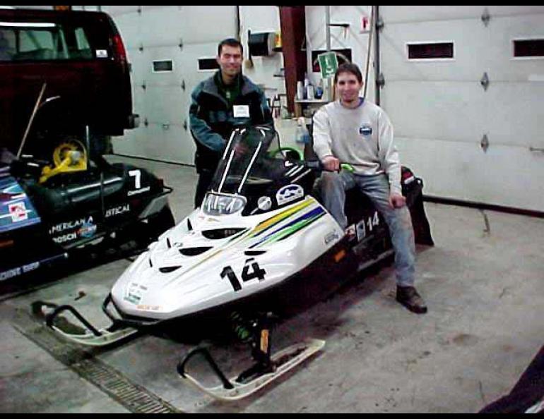 UAF engineering students Edwin Dale Hahn, left, and Jason Rohwer pose with their entry in the Society of Automotive Engineers Clean Snowmobile Challenge, held outside Yellowstone National Park in March, 2001. -Photo courtesy of Jason Rohwer.