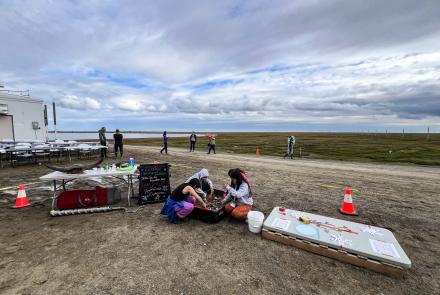 Elementary school students digging in the ‘Permafrost Exploration Sled’ while at the BARC Science & Culture Fair in August 2024. Photo by Serina Wesen