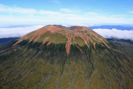 Mount Edgecumbe (L’úx Shaa), viewed from a helicopter in summer 2023, rises from forests on Kruzof Island about 15 miles west of Sitka. Photo by Ronni Grapenthin, Alaska Volcano Observatory/ University of Alaska Fairbanks Geophysical Institute