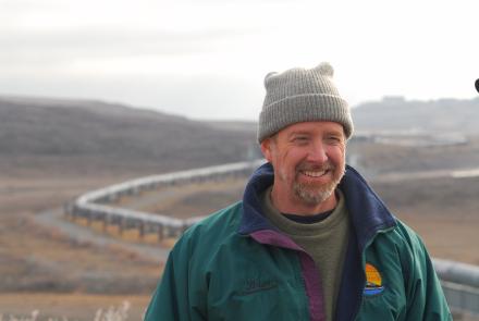 Brian Barnes listens to a colleague while studying ground squirrels near the trans-Alaska pipeline north of the Brooks Range on Sept. 21, 2007. Photo by Øivind Tøien.