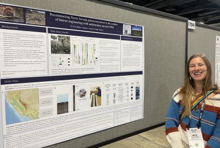 Neve Baker stands beside her poster on discovering ancient evidence of beavers in Grand Tetons National Park while she was at the Fall Meeting of the American Geophysical Union in Washington, D.C. in December 2024. Photo by Ned Rozell.