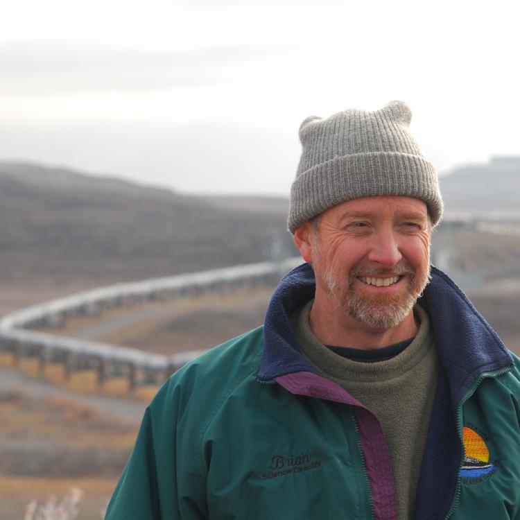 Brian Barnes listens to a colleague while studying ground squirrels near the trans-Alaska pipeline north of the Brooks Range on Sept. 21, 2007. Photo by Øivind Tøien.