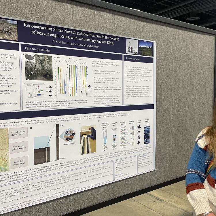 Neve Baker stands beside her poster on discovering ancient evidence of beavers in Grand Tetons National Park while she was at the Fall Meeting of the American Geophysical Union in Washington, D.C. in December 2024. Photo by Ned Rozell.