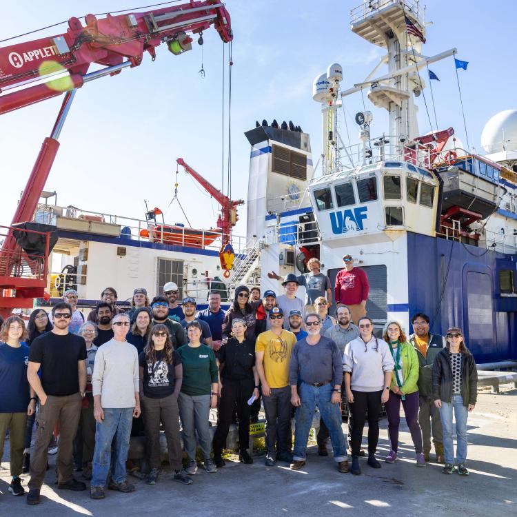 Researchers and crew members pose beside the University of Alaska Fairbanks research ship Sikuliaq in Dutch Harbor during a 2023 cruise to the Bering Sea to learn more about the Bering Land Bridge. Photo by JR Ancheta.